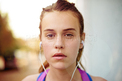 Buy stock photo Girl, runner or teenager with music in city for fitness, training or exercise health in portrait. Face, sports earphones or athlete woman in urban town for workout practice, outdoor jog or podcast