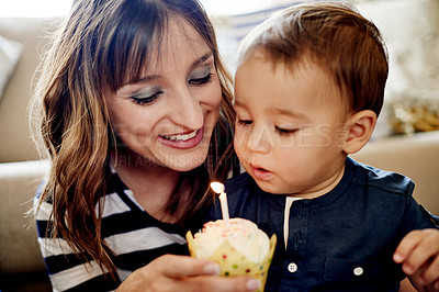 Buy stock photo Birthday, candle or cupcake with mom and son on sofa in living room of home for milestone. Celebration, growth or party with boy child and single parent woman in apartment for bonding as family