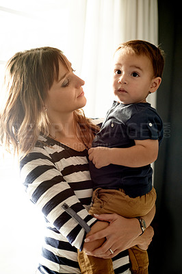 Buy stock photo Happy, bonding and mom with toddler in home with love, care and connection together on weekend. Smile, family and mother holding boy kid for growth and childhood development in living room at house.