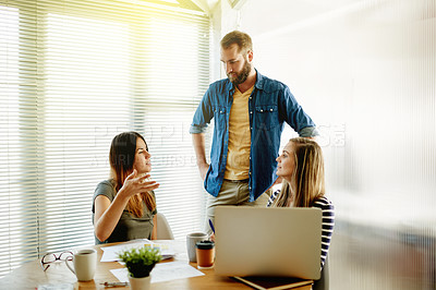 Buy stock photo Collaboration, meeting and planning with business people in office together for brainstorming. Conversation, creative and laptop with designer team in workplace for discussion, ideas or strategy