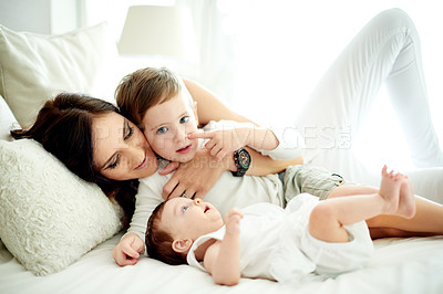 Buy stock photo Happy, mother and children in bedroom with care, love and bonding together for special family memory. Woman, son and daughter at home with trust, smile embrace and affectionate for connection.