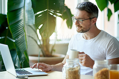Buy stock photo Coffee, laptop and remote work with man in home for conservation or sustainability research. Breakfast, computer and plants in apartment with freelance employee drinking beverage for green startup