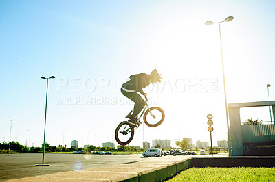 Buy stock photo Bicycle, air and man with trick in city with flare, jump or stunt for extreme sports outdoor. Skill, action and person on bike for fitness, cyclist challenge or rider with talent in urban park