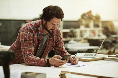 Buy stock photo Man, writing and phone in woodwork workshop for trade, stock and supply chain. Craftsmanship, research or artisan planning with mobile in warehouse for notes, project checklist and small business