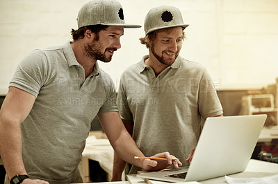 Buy stock photo Happy, teamwork and men in workshop with laptop, meeting or feedback on remodeling project. Smile, discussion and contractor in shop with tech, production update or research for renovation vision.