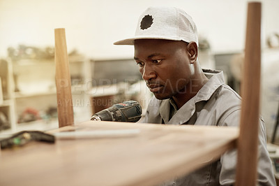 Buy stock photo Drill, carpenter and man in workshop with woodwork, restoration and building furniture. Handyman tools, craftsman or black person in factory for cabinet making, manufacturing or industrial production
