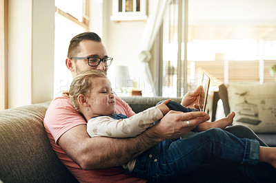 Buy stock photo Happy, child and dad with tablet, lounge and watching movie with subscription on website and bonding. Family, man and streaming cartoons with daughter, online and entertainment with tech in house