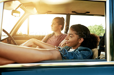 Buy stock photo Sunset, road trip and women in car for holiday, travel or vacation on outdoor adventure. Happy, explore or friends with destination, view or motor vehicle for weekend getaway, scenery or journey