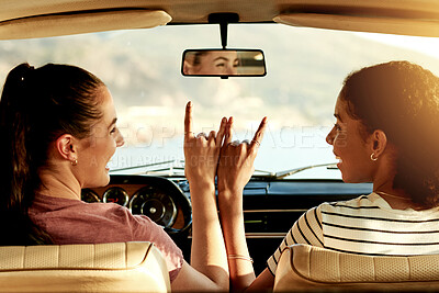 Buy stock photo Car, friends or rock sign on road trip for adventure, weekend break or travel to heavy metal concert. Happy, people and horn emoji together in vehicle for holiday getaway, vacation freedom or bonding