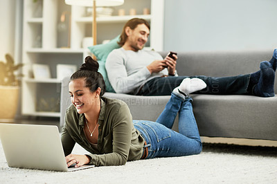 Buy stock photo Laptop, smile and typing with woman on floor in living room of home to search for movie review. Break, computer and relax with happy couple in apartment together for me time or wellness on weekend