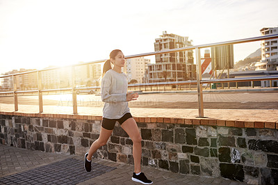 Buy stock photo Fitness, cardio and woman running outdoor for healthy body, wellness and exercise to lose weight at sunset. Jog, city and happy athlete training, sports or endurance workout with energy for marathon