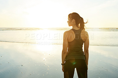 Buy stock photo Fitness, sunset and woman with break by beach for workout, exercise and resting with lens flare. Back, female athlete and sightseeing with sunrise view, nature scenery and body wellness by seashore