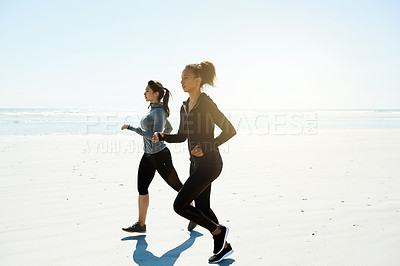 Buy stock photo Fitness, women and running on beach for exercise, wellness or cardio training with space. Friends, runners and challenge at ocean for competitive workout, endurance or marathon practice together