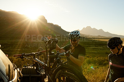 Buy stock photo Couple, cyclist and bike with car rack in nature for workout preparation or outdoor sport together. Active man, woman or getting ready with bicycle, flare or sun for exercise or ride in countryside
