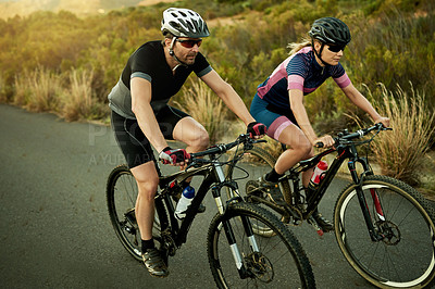 Buy stock photo Fitness, race and couple with bicycle, nature or cycling for wellness, active and helmet for safety. Healthy, athlete and people with eco friendly transport, travel and exercise with bike and outdoor