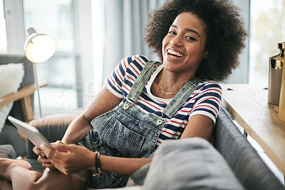 Buy stock photo Black woman, tablet and laugh on sofa, relax and portrait for streaming, movies or video in home. African girl, smile and tech on couch, comedy film and app with subscription at apartment in Kenya