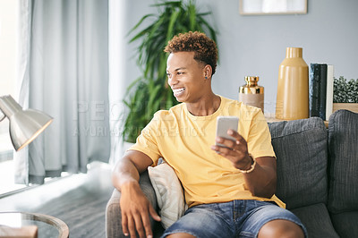 Buy stock photo Thinking, phone and man on sofa in home with networking, communication or social media on mobile app. Happy, ideas and male person with cellphone for texting, contact or chatting in living room.