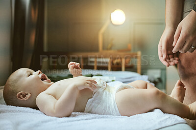 Buy stock photo Baby, bedroom and diaper with a father changing the nappy of his boy in their home during childcare. Babies, change and cleaning with a responsible dad caring for his newborn infant in the house