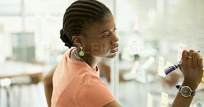 Buy stock photo Woman, sticky note or glass board with writing for brainstorming, planning and project management in modern office. Young person, thinking and scrum post it on wall for creative strategy in workplace