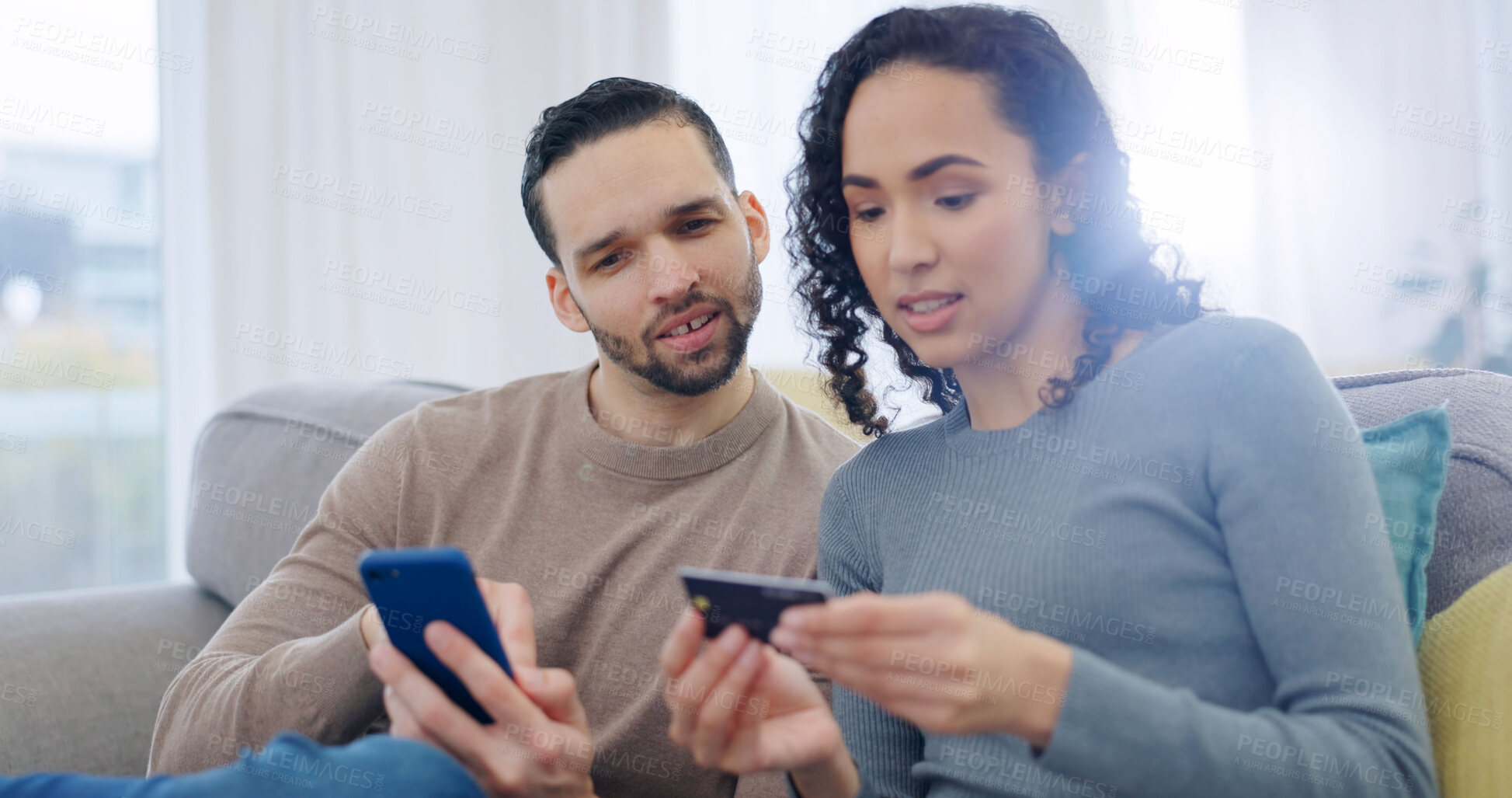 Buy stock photo Couple, phone and home with credit card for online shopping, banking app or wireless transaction. Man, woman and ecommerce with debit or technology on sofa for payment, purchase or order in house
