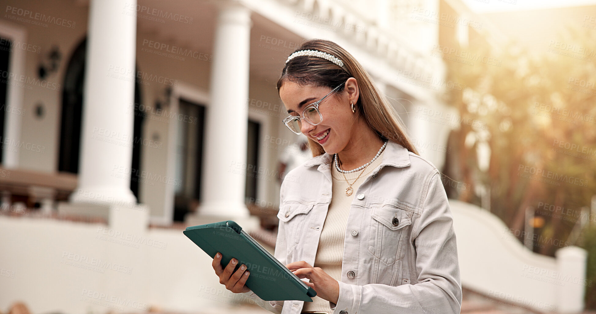 Buy stock photo Smile, woman and student at campus with tablet, test results and acceptance email for new semester. Study, female person and tech at university for enrollment, scholarship update and exchange program