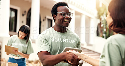 Buy stock photo Donation, volunteer or happy man with handshake for charity, checklist or fundraiser campaign. Male person, activist or shaking hands with smile for community service or outdoor outreach together