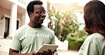 Smile, man and tablet outdoor for volunteering, sign up and appoint tasks for community outreach. Happy, coordinator and people with digital for charity, participation and job allocation for welfare