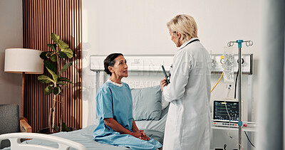 Buy stock photo Doctor, woman and talk on hospital bed with checkup, help and questions for cervical cancer symptoms. Healthcare worker, mature people and speaking in oncology clinic with advice, treatment or update