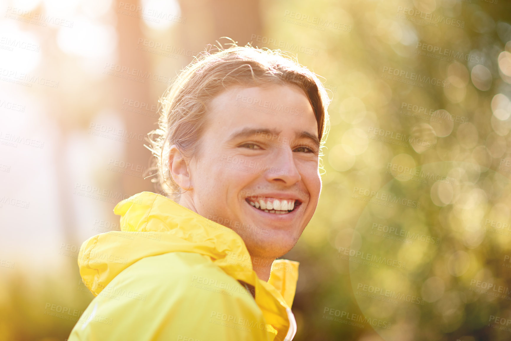 Buy stock photo Portrait, runner and man in forest, smile and training with challenge, wellness and energy. Person, outdoor and athlete in woods, happiness and exercise with practice, nature and cardio with fitness