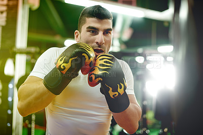 Buy stock photo Man, punching bag and workout at gym with boxing, power and mixed martial arts with gloves. Person, fighter and boxer with equipment for training, exercise and strong with fist at combat sports club
