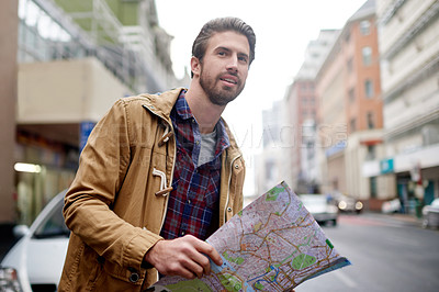Buy stock photo Map, street and travel with man in city for commute to location as tourist on holiday or vacation. Directions, journey and navigation with person in urban town for adventure or exploration abroad