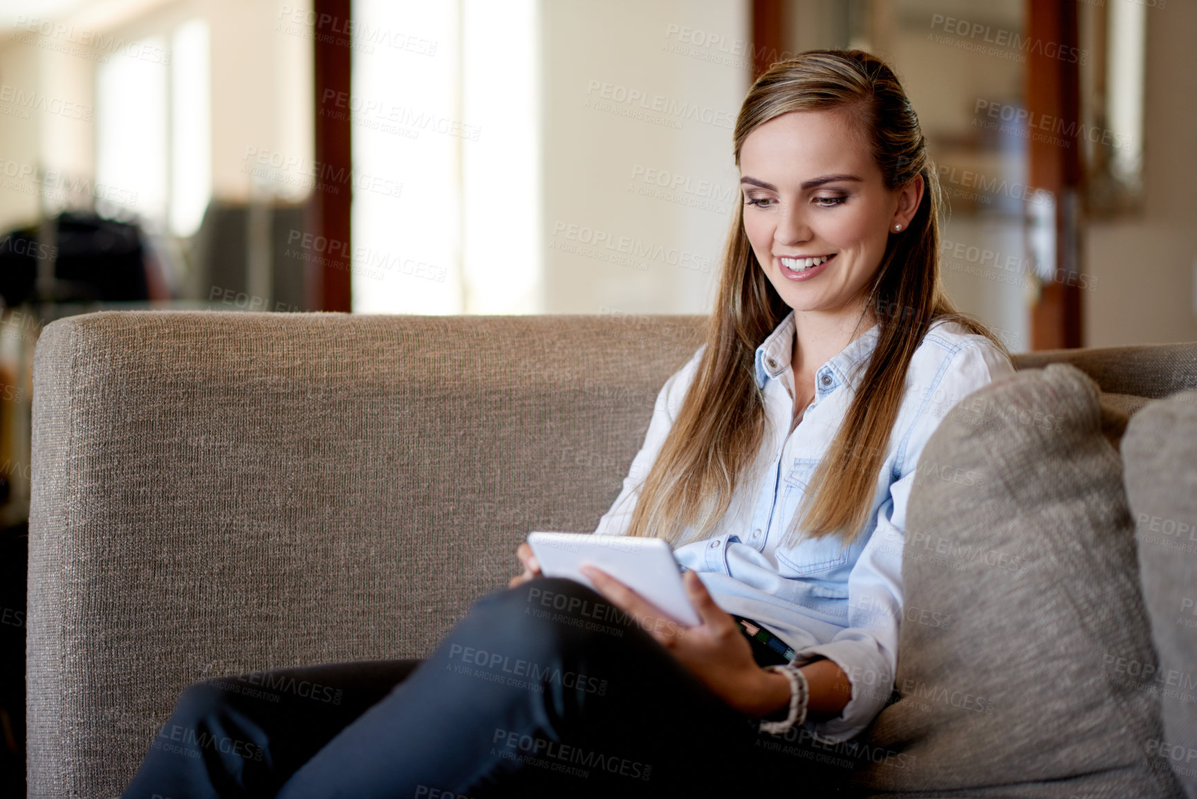 Buy stock photo Home, relax and woman on couch, tablet and online reading with entertainment, chatting and email. Apartment, tech and person with smile, digital app and message to contact, break or communication