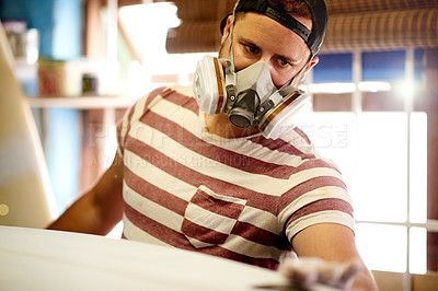 Buy stock photo Mask, PPE and man with surfboard, sanding and creative for skills, talent and hobby. Craftsman, artist and entrepreneur with workshop for design, manufacturing and custom work for artisan craft