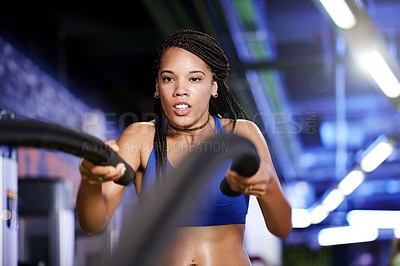 Buy stock photo Battle ropes, fitness and black woman in gym for exercise, bodybuilder workout and training. Sports, intense and person with muscle strength, power and equipment for wellness, health and challenge