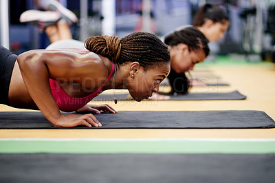 Buy stock photo Fitness, women and push up in gym class for collaboration, arm muscle development or exercise group. Bodybuilder, workout and personal trainer with team for strength, commitment or sport activity