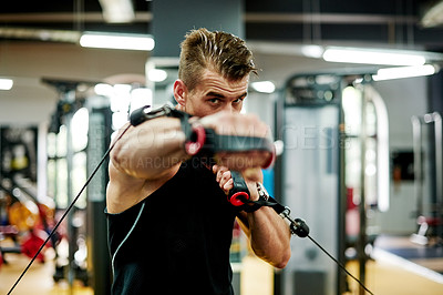 Buy stock photo Athlete, punch and cable machine at gym for fight practice, boxing endurance or stamina training. Boxer, man and rope pulley at sports club for competition fitness, workout portrait or match exercise