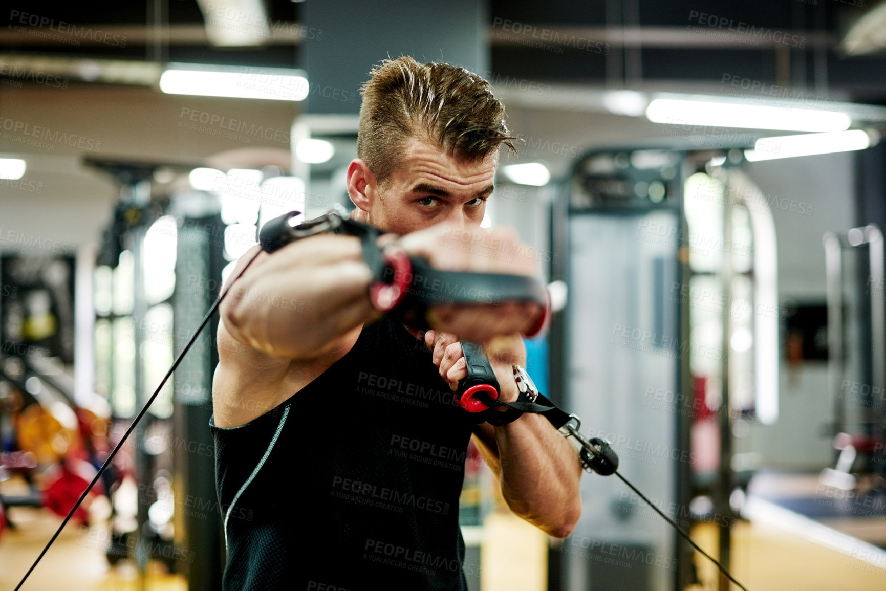 Buy stock photo Athlete, punch and cable machine at gym for fight practice, boxing endurance or stamina training. Boxer, man and rope pulley at sports club for competition fitness, workout portrait or match exercise