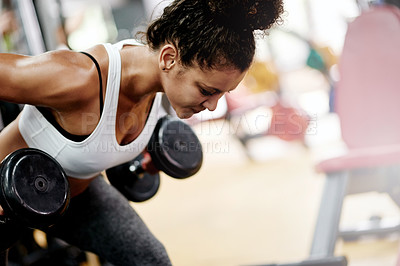 Buy stock photo Fitness, exercise and woman in gym with weightlifting, workout or performance for progress. Serious, athlete and commitment in health center with training, muscles and development with dumbbells