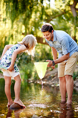 Buy stock photo Father, child and happy with fish in net for holiday catch, teaching skills and weekend hobby. Family activity, dad and girl with fishing in river for summer vacation, learning and travel adventure