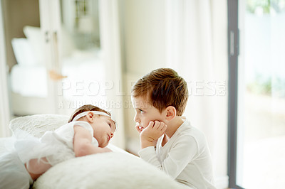 Buy stock photo Baby, bonding and funny face of boy in bedroom of home with sibling for development or growth. Family, humor or love with brother and infant sister on bed in apartment together for safety or security