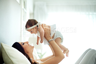 Buy stock photo Happy, mother and child in bedroom with care, love and bonding together for connection. Woman, daughter and playing at home with trust, smile embrace and affectionate for special family memory.