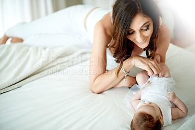 Buy stock photo Love, mom and baby in house on bed, lens flare and bonding together in nursery. Mother's Day, relax and happy family in bedroom with newborn, support and connection for childhood development.