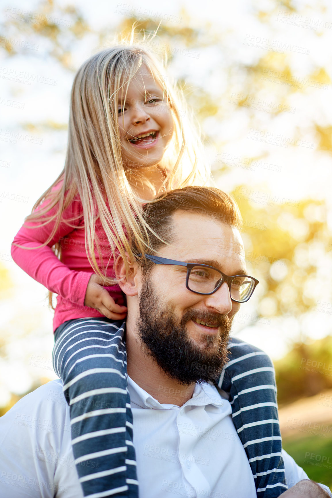 Buy stock photo Happy, father and toddler on shoulder at park for travel, playful fun and bonding together on holiday. Smile, man and carry child with love, balance support and vacation with games to explore nature