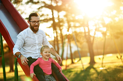 Buy stock photo Nature, slide and dad with child in park for holiday, weekend or vacation together in sunshine. Smile, connection and girl kid with father for playing outdoor on playground for bonding in summer.