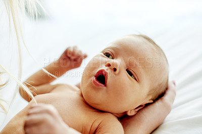 Buy stock photo Baby, newborn and parent in nursery with bonding, relax and curious face with support in family house. People, love and care with early child development, alert and awake with healthy infant