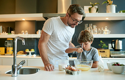 Buy stock photo Man, son and cooking at kitchen with ingredients, teaching and help preparation for breakfast. Mature father, child and mixing eggs in home with whisk, bonding and connection for homemade snack.