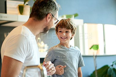Buy stock photo Baking, parent and child in kitchen with flour, bonding together or support for dessert preparation. Happy, father or son learning with powder ingredients, homemade sweet treats or assistance in home