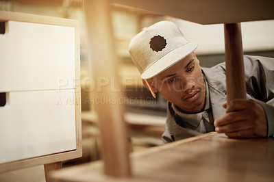 Buy stock photo Carpenter, man and furniture in workshop for manufacturing process, production or fix. African person, carpentry industry and woodwork for repair, joinery and creative craft in factory with design