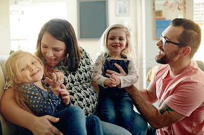 Buy stock photo Smile, parents and hug kids at house with love, trust and bonding together with playful games. Happy, people and embrace children with fun for security, family connection and affection in living room
