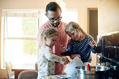 Buy stock photo Dad, children and learning to bake cookies with dough in bowl, help and together with family. Kids, father and baking with parent in home kitchen, teaching recipe and dessert preparation with girls
